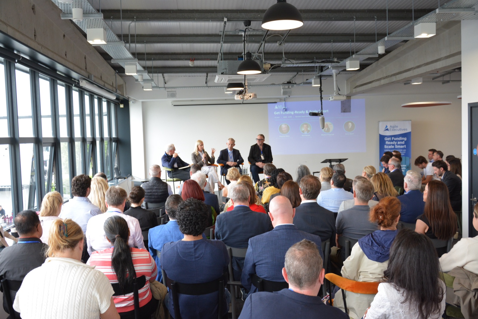 Panellists in conversation on stage