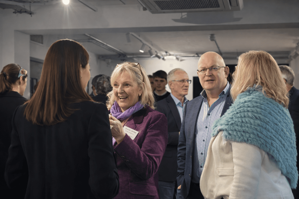 Networking at the May panel